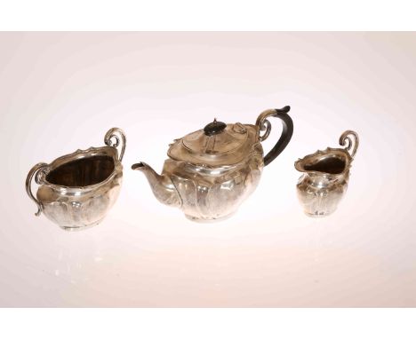 A GEORGE V SILVER THREE PIECE TEA SERVICE, James Deakin & Sons, Sheffield 1918, comprising teapot, two-handled sugar bowl and