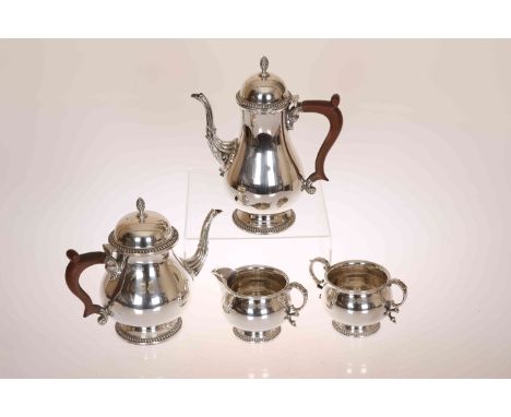 A SILVER FOUR PIECE TEA AND COFFEE SERVICE, Barker Ellis Silver Company, Birmingham 1967, comprising pear-shaped coffee pot, 