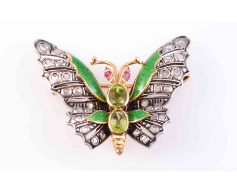 A DIAMOND, PERIDOT AND ENAMEL BUTTERFLY BROOCH, CIRCA 1890, the realistic moulded wings set throughout with graduating collet