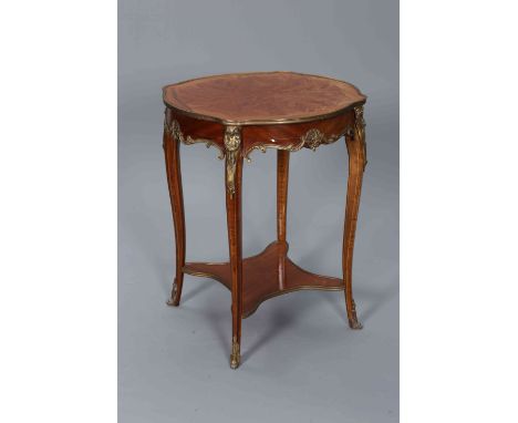 A LOUIS XV STYLE MARQUETRY AND GILT METAL MOUNTED OCCASIONAL TABLE, the shaped circular top above a frieze applied with C-scr