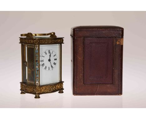 A FRENCH BRASS AND CHAMPLEVE ENAMEL CARRIAGE CLOCK, 19TH CENTURY, the case of serpentine outline, the top and base with C-scr
