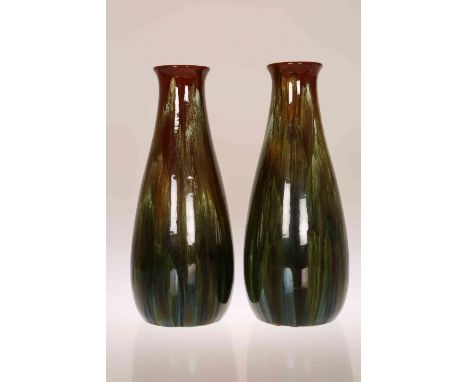 A PAIR OF LINTHORPE POTTERY VASES, of torpedo form, glazed in mottled green and brown, marks indistinct. 32.5cm