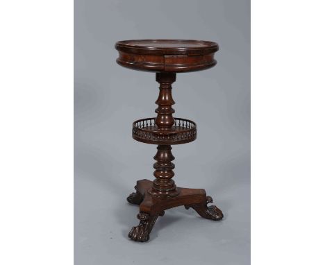 A REGENCY ROSEWOOD WORK TABLE, the dished circular top rising from a waisted well, raised on a turned baluster stem with a sh