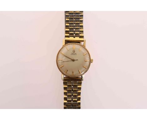AN OMEGA 9 CARAT GOLD AUTOMATIC WRISTWATCH, the circular dial with baton markers and centre sweep seconds, the case back with