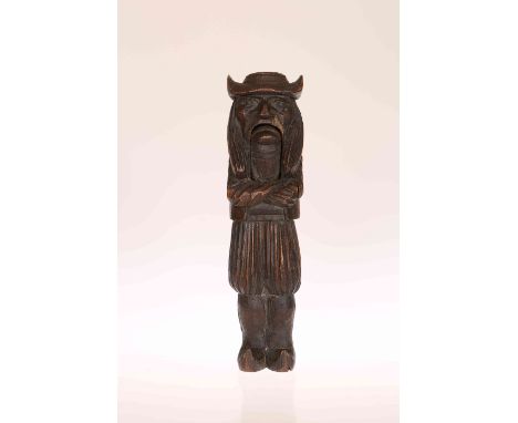 A FRENCH CARVED WOODEN NUTCRACKER, late 19th Century, modelled as a Breton man. 20.5cm