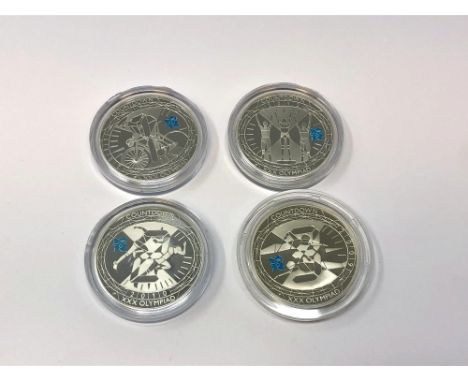 Four London 2012 Olympics silver proof commemorative crowns. (4)