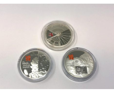 Three London 2012 Olympics silver proof commemorative crowns. (3)