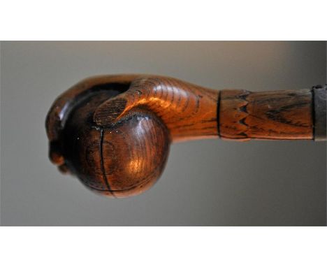 A good antique walking stick with a cricket ball engraving to the handle.