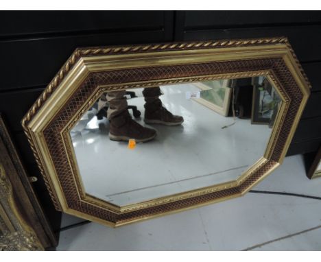 a vintage hall way mirror with gilt effect frame