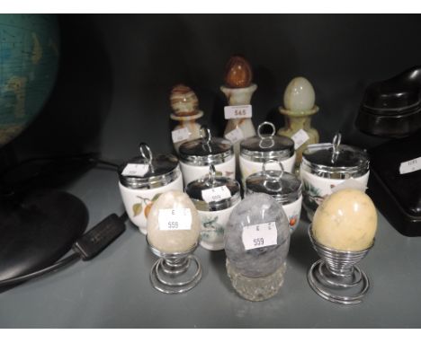 A selection of Royal Worcester egg coddlers, onyx eggs etc