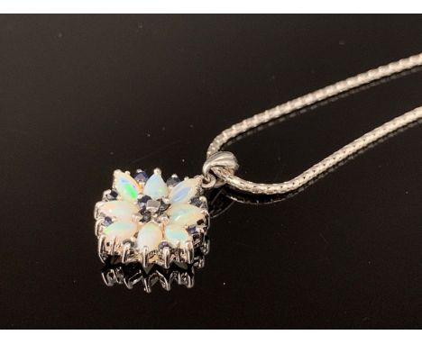 A contemporary 9ct white gold, opal and sapphire flower head cluster pendant on a snake-link neck chain, 5.2g 