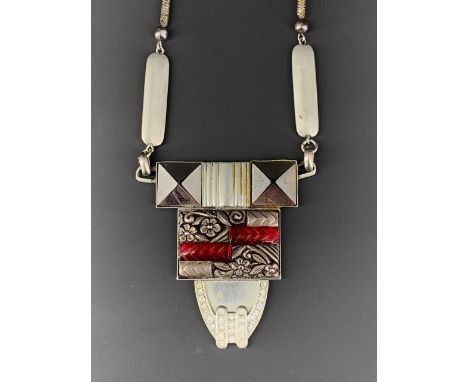 A vintage Art Deco pendant necklace, in a tiered geometric arrangement, on a snake-link neck chain, in base white metal, pend