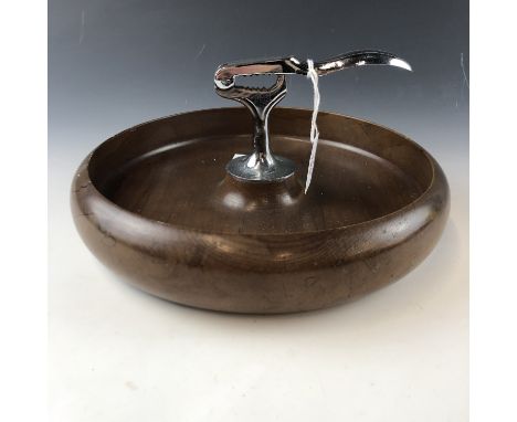 A mid century turned wooden nut bowl with integral cracker 