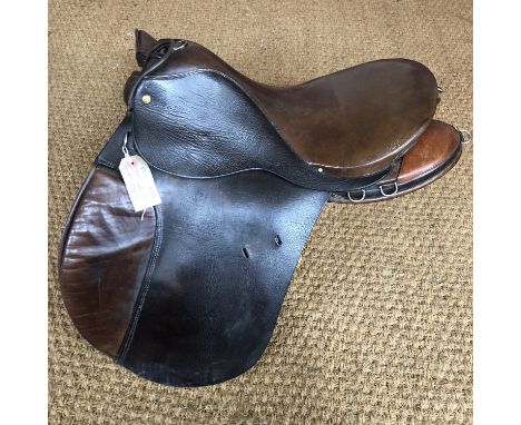 A vintage Police horse saddle on military pattern tree