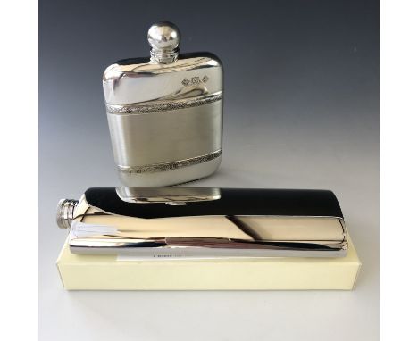 A contemporary pewter hip flask with Celtic interlaced decorative bands, together with a polished steel flask