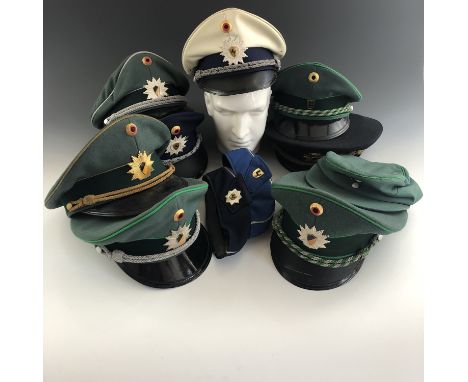 A quantity of post-War German Baden-Wurtemberg Police / Deutsche Polizei caps