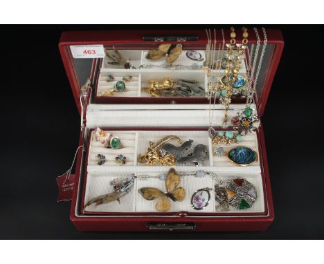 A contemporary red leather jewellery box containing vintage and modern costume jewellery, including a Second World War period