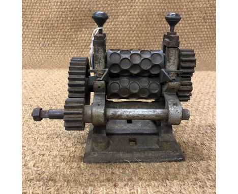 A late 19th / early 20th century cast iron and brass confectionary roller by Brierley of Ruchdale 