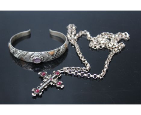 A SILVER AND AMETHYST BANGLE, with yellow metal embellishment, stamped 925, together with a white metal pendant cross set wit