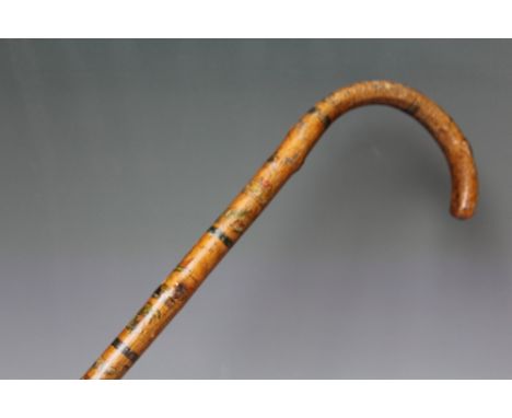 A FOLK ART WALKING STICK,  decorated all over with painted scenes, figures and animals, L 94 cm