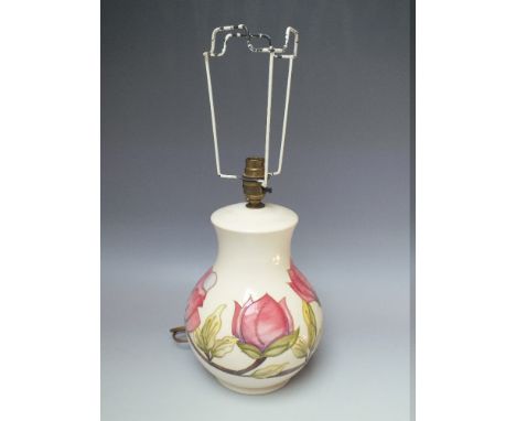 A LARGE MOORCROFT 'MAGNOLIA' PATTERN TABLE LAMP, complete with shade, impressed and painted marks to base, H 31 cm (to inc ba