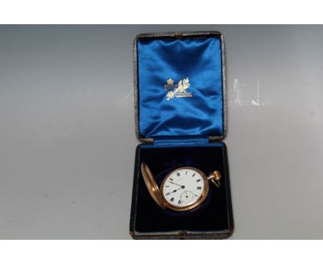 A 9CT GOLD FULL HUNTER MANUAL WIND POCKET WATCH, having a white enamel dial, Roman numeral hour markers, secondary outer minu