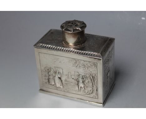 A HALLMARKED DUTCH SILVER CADDY, marks possibly that for Rotterdam ?, decorated with typical scenes on all sides, approx weig