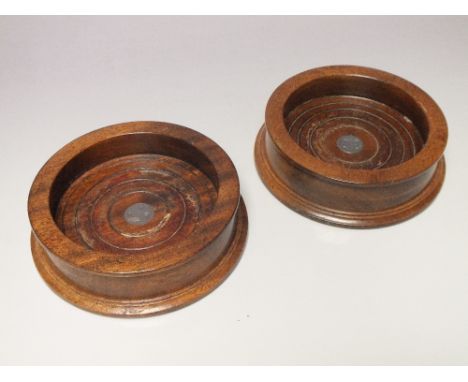 A PAIR OF HALLMARKED SILVER DISC INLAID WOOD TURNED WINE COASTERS - LONDON 1980, maker's mark PH, Dia. 14 cm  (2)