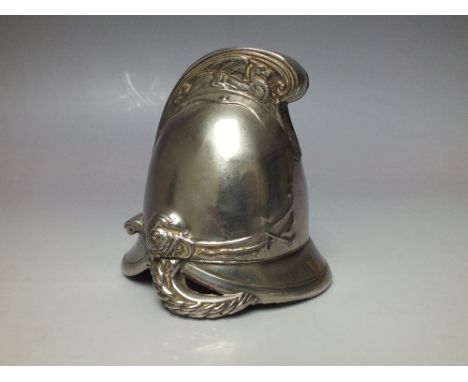 A NOVELTY CAST METAL PIN CUSHION, modelled in the form of a vintage fireman's helmet, the hinged lid opening to reveal pin cu