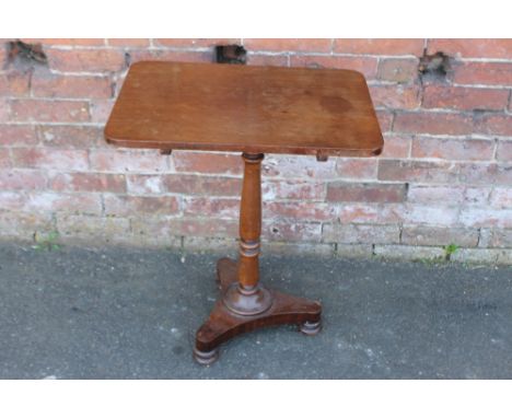 A 19TH CENTURY MAHOGANY PEDESTAL TABLE, the shaped rectangular top with original snap lock mechanism, raised on a turned colu