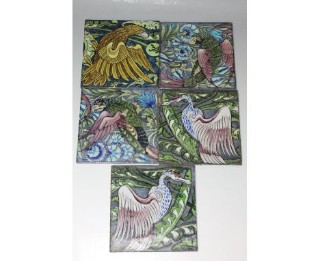 A SET OF FOUR WILLIAM DE MORGAN SANDS END POTTERY TILES, decorated with exotic birds, two impressed with circular impressed S