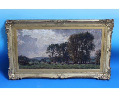 EDWARD R. KING (b.1863). Country landscape with cattle, signed lower left, oil on canvas, gilt framed, 45 x 90 cm
