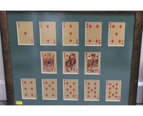A FRAMED COLLECTION OF FIVE ASSORTED SETS OF PLAYING CARDS, with certificate of authenticity, laboratory test report, gold ce