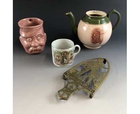 A "Gentleman in Khaki" novelty teapot and stand, a "1919 Pease" mug and a "Lucky Bob" mug (a/f)