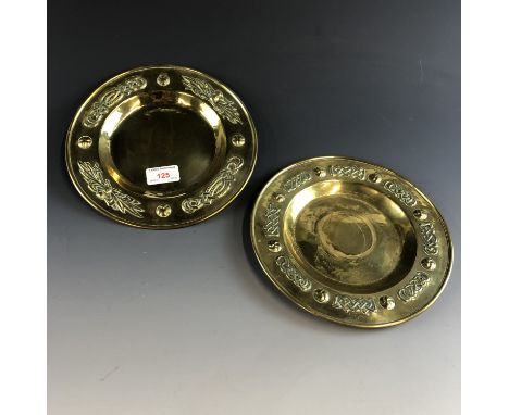 Two antique brass dishes / plaques of Celtic design, 23 cm