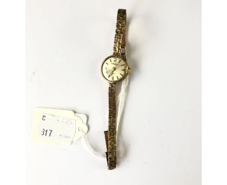 A lady's Patch of Shrewsbury 9ct gold cased wrist watch on a 9ct gold bark-effect bracelet strap, having a circular dial with