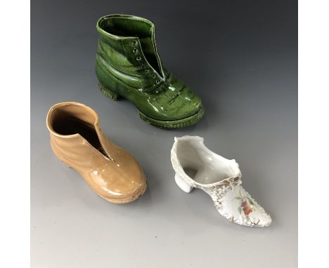 Two ceramic boots and a shoe