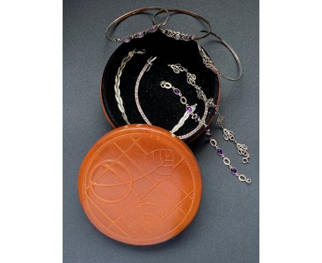 Silver and white-metal (tests as silver) bracelets, including three bangles of Celtic influence, and four bracelets, one havi