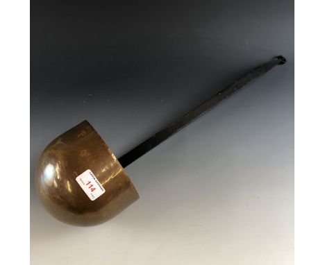 A large copper ladle, 60 cm