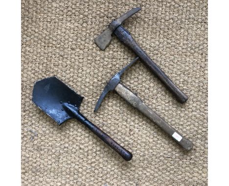 A 1915 dated entrenching tool and two pioneers' axes / tools