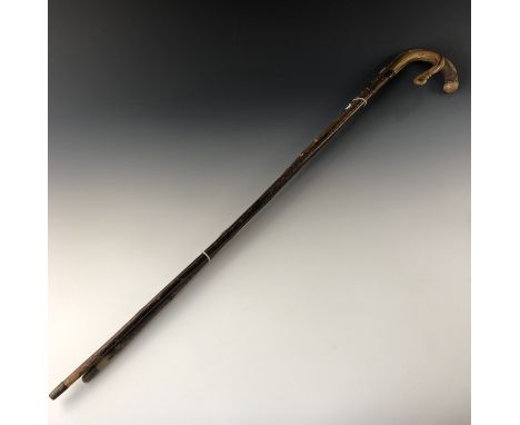 A silver collared walking stick and a child's shepherds crook