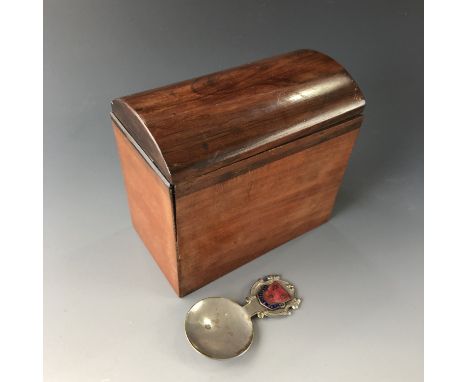 A mahogany tea caddy and spoon