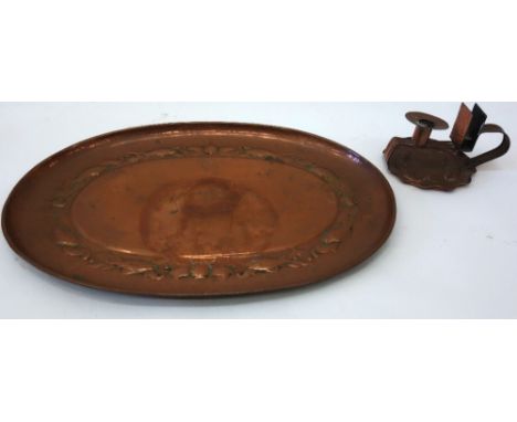 A copper oval tray, probably Newlyn, the raised centre with a border of fish and shells and dished rim, 51cm x 35cm, together