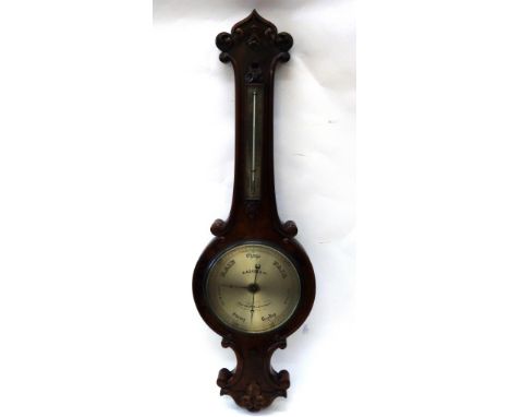 Salom & Co Edinburgh & London: a Victorian figured walnut cased wheel barometer thermometer, foliate and scroll carved with s