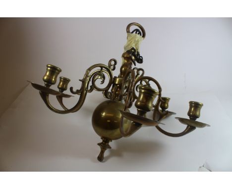 A Dutch brass six light chandelier, in 17th century style, late 19th/early 20th century, with scrolling branches and wide cir