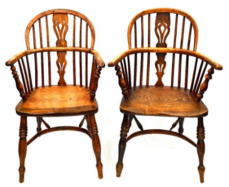 A harlequin set of four yew, ash and elm Windsor elbow chairs, first half 19th century and with later elements, having pierce