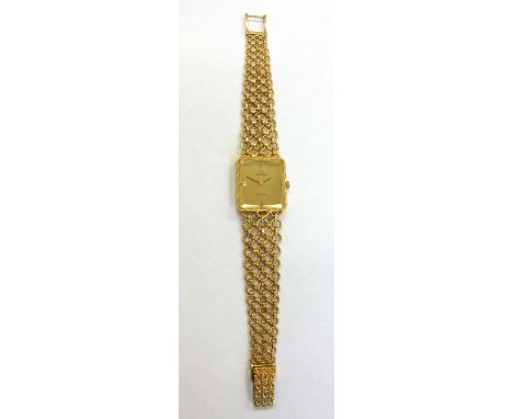 Omega De Ville; a lady's 18ct gold bracelet watch, circa 1972, the brushed gold dial with black baton quarters and hands, rec