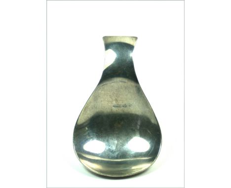 A contemporary silver caddy spoon, A. E. Jones, Birmingham 1971, with scroll handle and pear shape bowl.