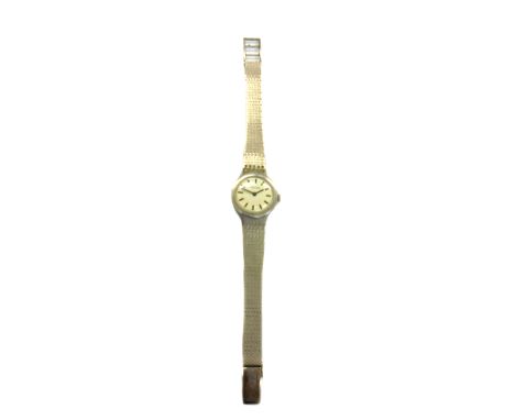 Ancre; a lady's bracelet watch, stamped '14K', cream dial with black baton numerals and hands, round case stamped '14K 0.585'