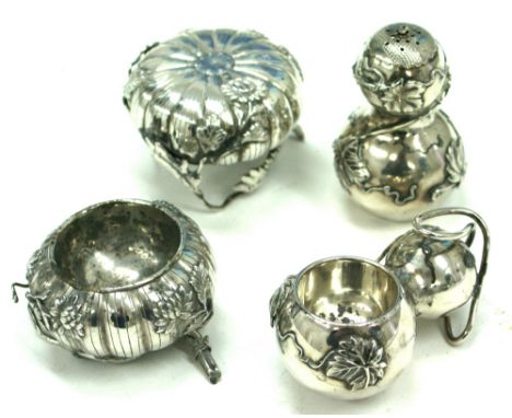 A pair of Japanese silver salt and peppers, first half 20th century, each in the form of a chrysanthemum, with flowering bran